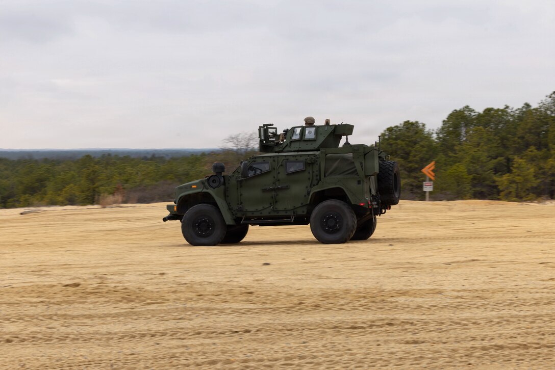 A U.S. Marine Corps combined anti-armor team listens to and repeats instructions during a live-fire exercise at Joint Base McGuire-Dix-Lakehurst, New Jersey, Dec. 6, 2025. Marines with 2nd Battalion, 25th Marine Regiment, 4th Marine Division, execute live-fire missions designed to sustain and refine tactical decision-making, leadership, and technical proficiency. The training improves unit readiness and ensures Marines maintain combat capabilities against armored threats. U.S. Marine Corps photo by Lance Cpl. Breysson Villacortacampos.)