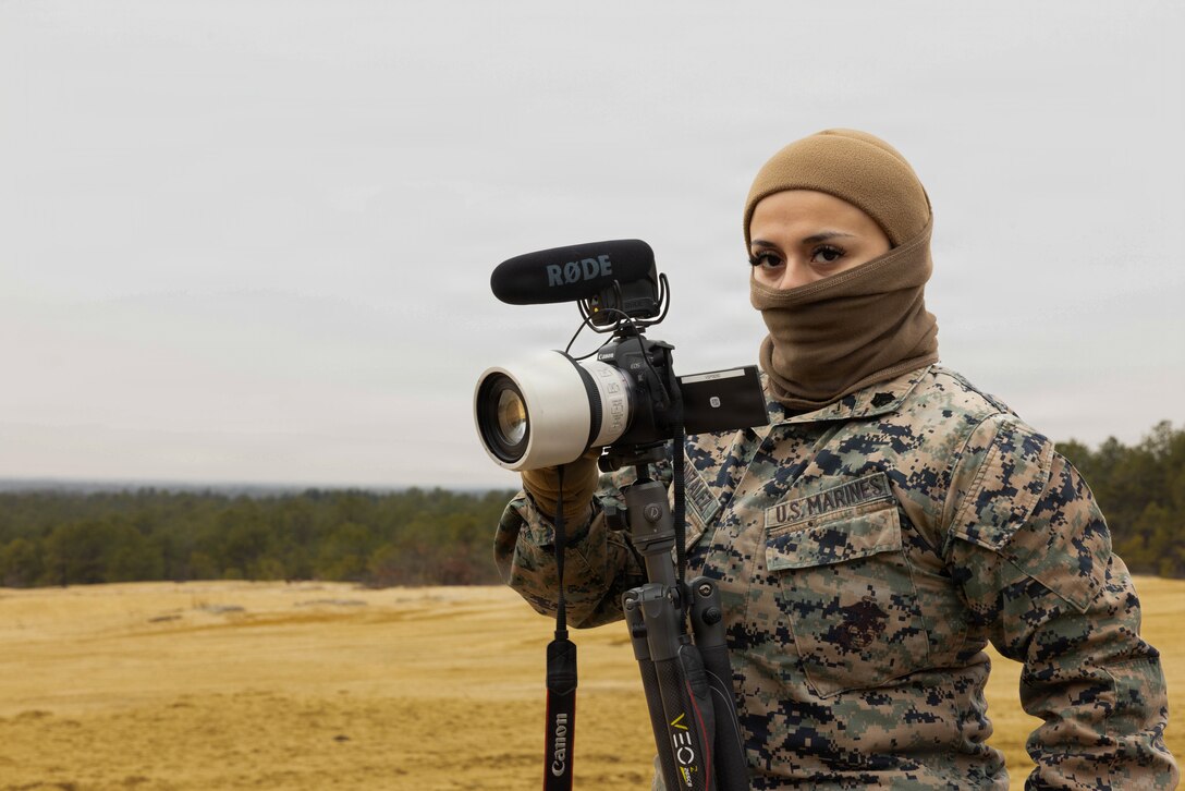 U.S. Marine Corps Sgt. Emely Gonzalez, a combat graphics specialist, poses for a photo during a live-fire exercise at Joint Base McGuire-Dix-Lakehurst, New Jersey, Dec. 6, 2025. Sgt. Gonzalez, with Marine Forces Reserve, observes live-fire drills with M252A2 81mm mortar systems designed to improve tactical decision-making, leadership, and technical skills while ensuring readiness for future missions. (U.S. Marine Corps photo by Lance Cpl. Breysson Villacortacampos)
