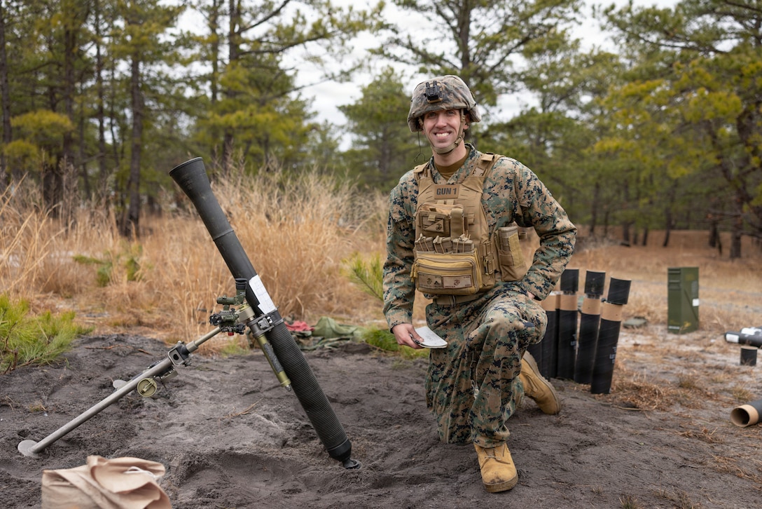 U.S. Marine Corps Lance Cpl. Matthew Brech, a mortarman, poses for a photo during a live-fire exercise at Joint Base McGuire-Dix-Lakehurst, New Jersey, Dec. 6, 2025. Lance Cpl. Brech, with 2nd Battalion, 25th Marine Regiment, 4th Marine Division, participates in live-fire drills with M252A2 81mm mortar systems to improve tactical decision-making, leadership and technical skills while maintaining readiness for future missions. (U.S. Marine Corps photo by Lance Cpl. Breysson Villacortacampos)