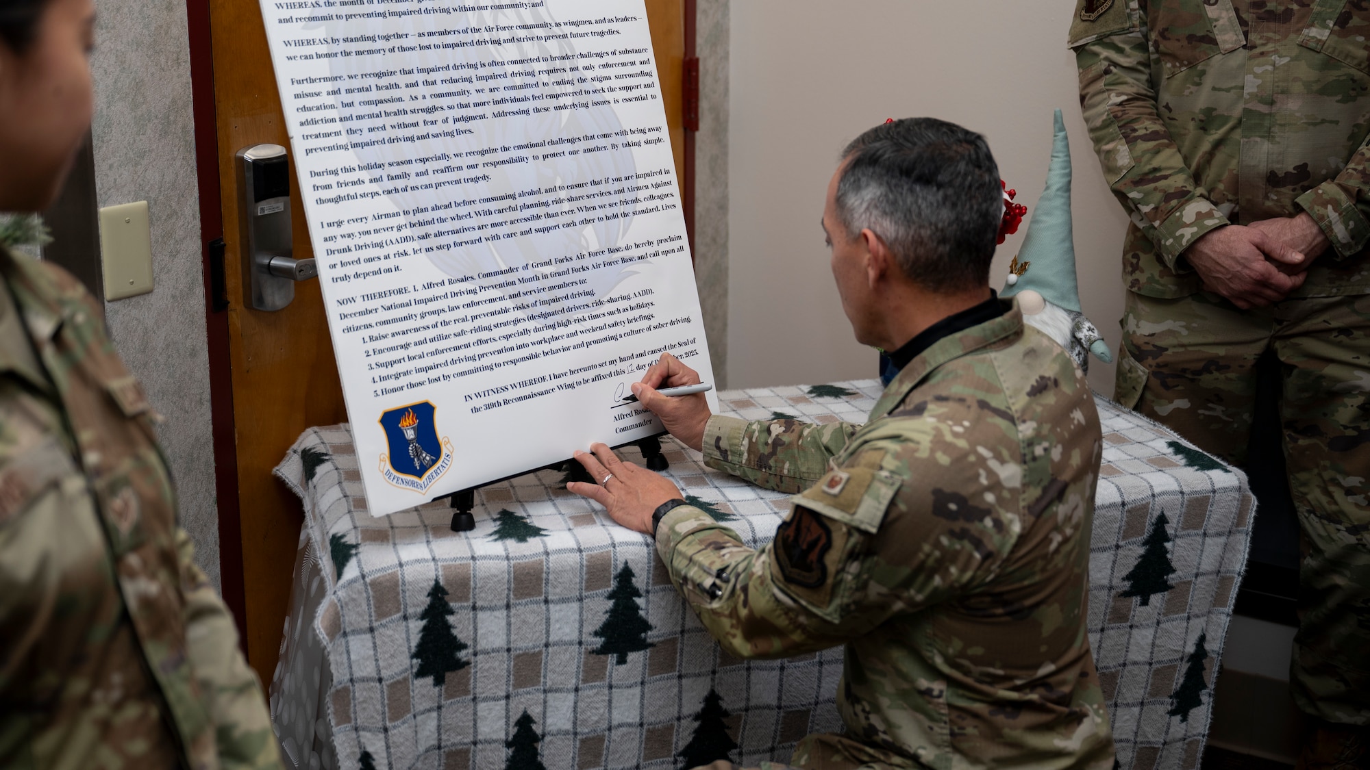 Airmen gather for a proclamation signing