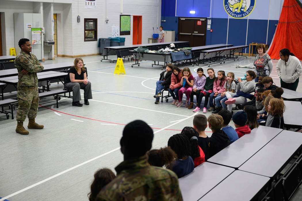 A U.S. Airman teaches third graders at Spangdahlem Elementary School about motion and matter.