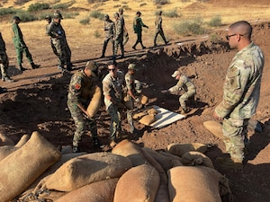 U.S. Air Force explosive ordnance disposal technicians assigned to the 6th Air Refueling Wing and U.S. Army explosive ordnance disposal technicians assigned to the 761st Ordinance Company, demonstrate safe demining techniques to members of the Royal Moroccan Armed Forces during a Humanitarian Mine Action (HMA) mission in Maaziz, Morocco, Aug. 27, 2025. The HMA program is a U.S.-led effort to train partner nations in explosive ordnance disposal. The training enhances EOD capabilities and supports ongoing international efforts to reduce the threat of unexploded ordnance to local communities. (U.S. Air Force courtesy photo)