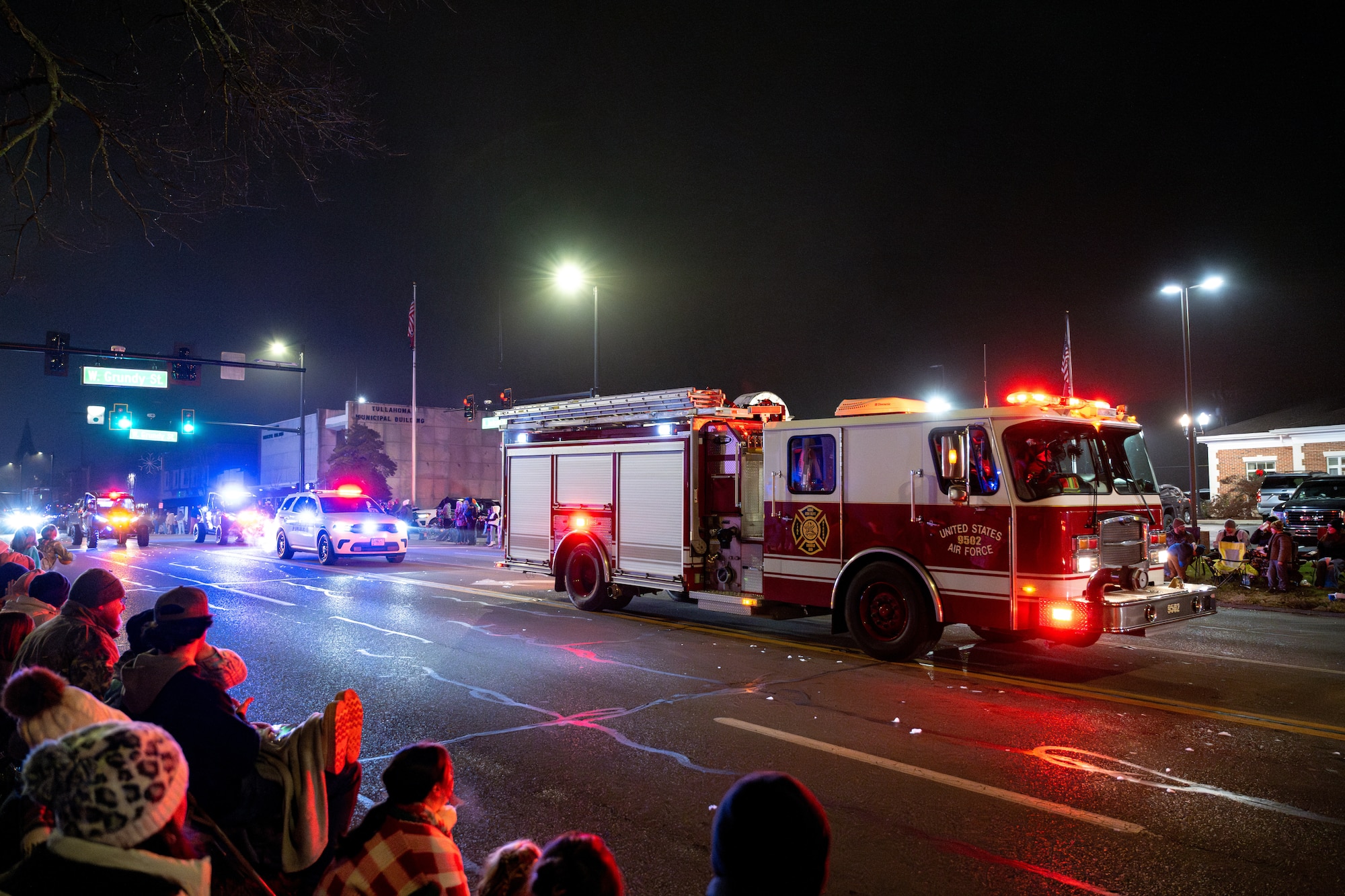 An Arnold Air Force Base Fire and Emergency Services fire engine makes its way up North Jackson Street during the 69th annual Tullahoma Christmas Parade Dec. 5, 2025, in Tullahoma, Tenn. Members of the Fire and Emergency Services team were joined by Arnold Air Force Base Security Forces and Arnold Engineering Development Complex leadership as they greeted paradegoers along the route. AEDC is headquartered at Arnold AFB. (U.S. Air Force photo by Brad Hicks)