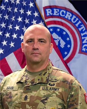 CSM photo in front of the U.S. Army and USARD flags