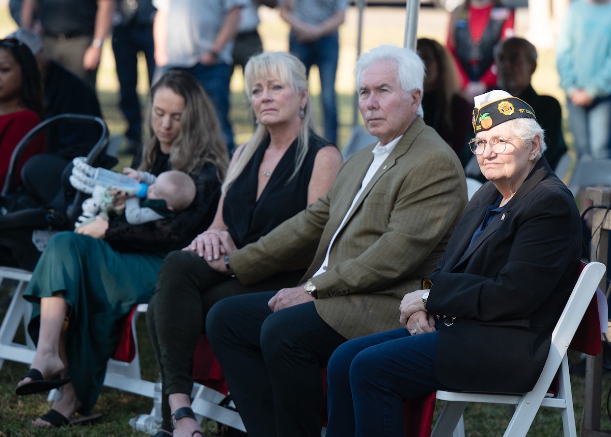 A Gold Star Family sits next to each other during the Wreaths Across America Placement Ceremony.