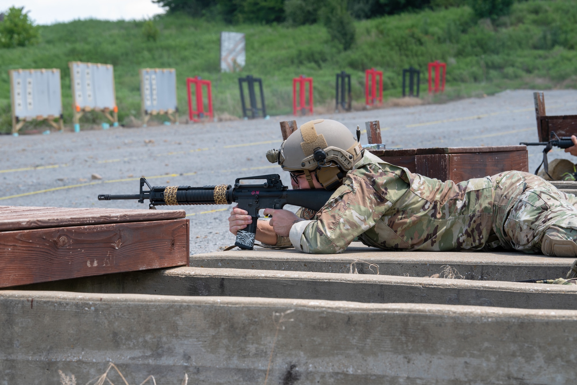 Airman 1st Class Charles Jenkins of the Kentucky Air National Guard’s 123rd Contingency Response Group aims an M16A4 rifle while prone July 12, 2025, during the Adjutant General’s Match, a marksmanship competition held at the Wendell H. Ford Regional Training center in Greenville, Ky. The event tested Soldiers and Airmen with realistic, combat-focused shooting scenarios designed to sharpen weapons proficiency and lethality. (U.S. Air National Guard photo by Airman 1st Class Angelee Barnett)