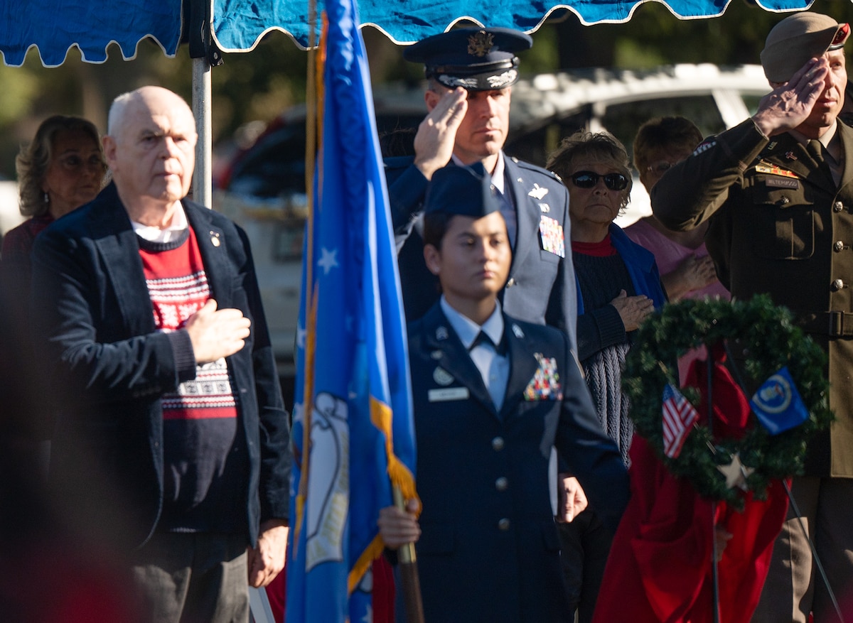 96th Test Wing deputy commander, salutes alongside U.S. State Representative for House District four during the Wreaths Across America Placement Ceremony.
