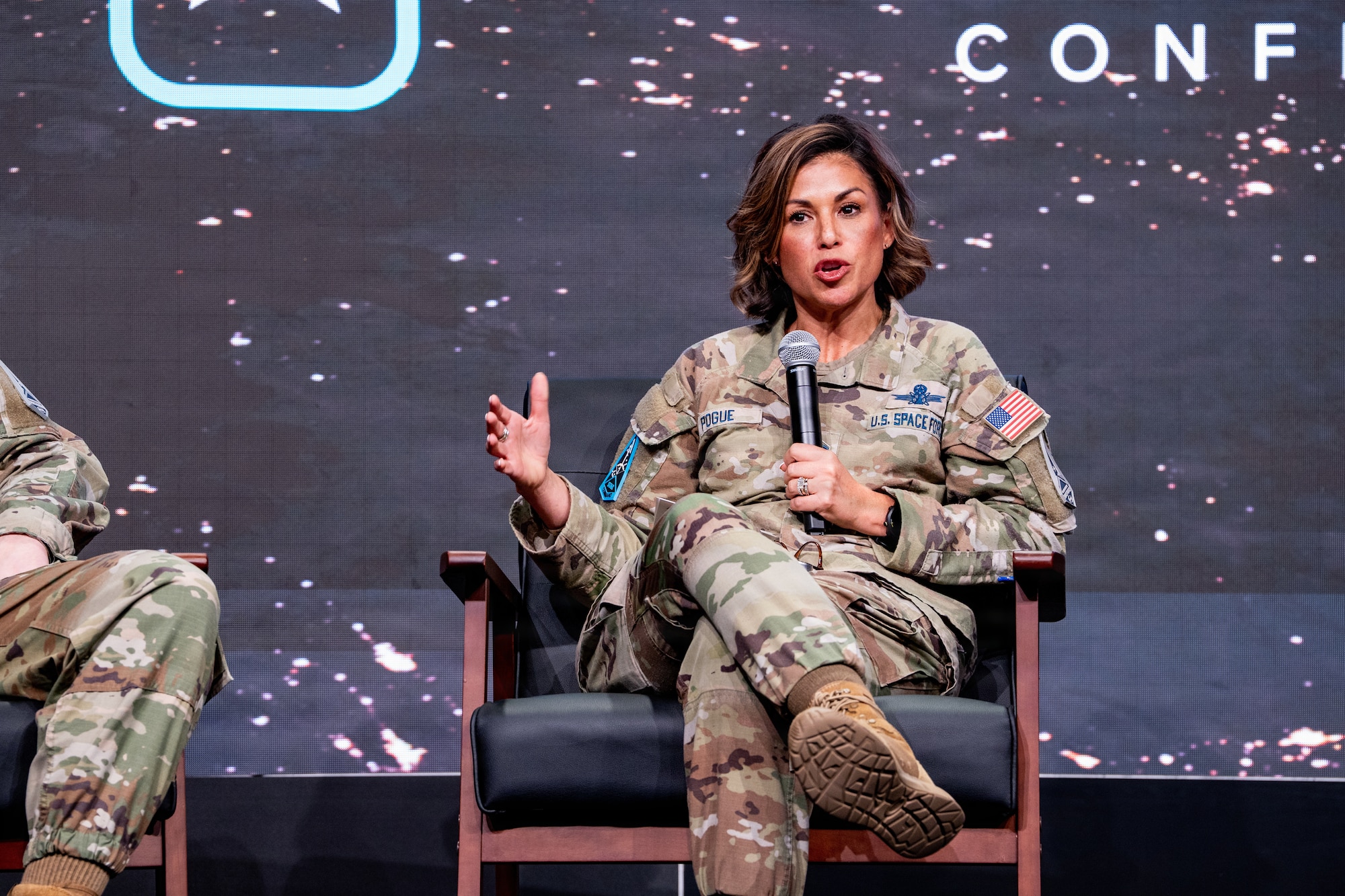 Space Force leader speaking at a conference in uniform. They are on stage.