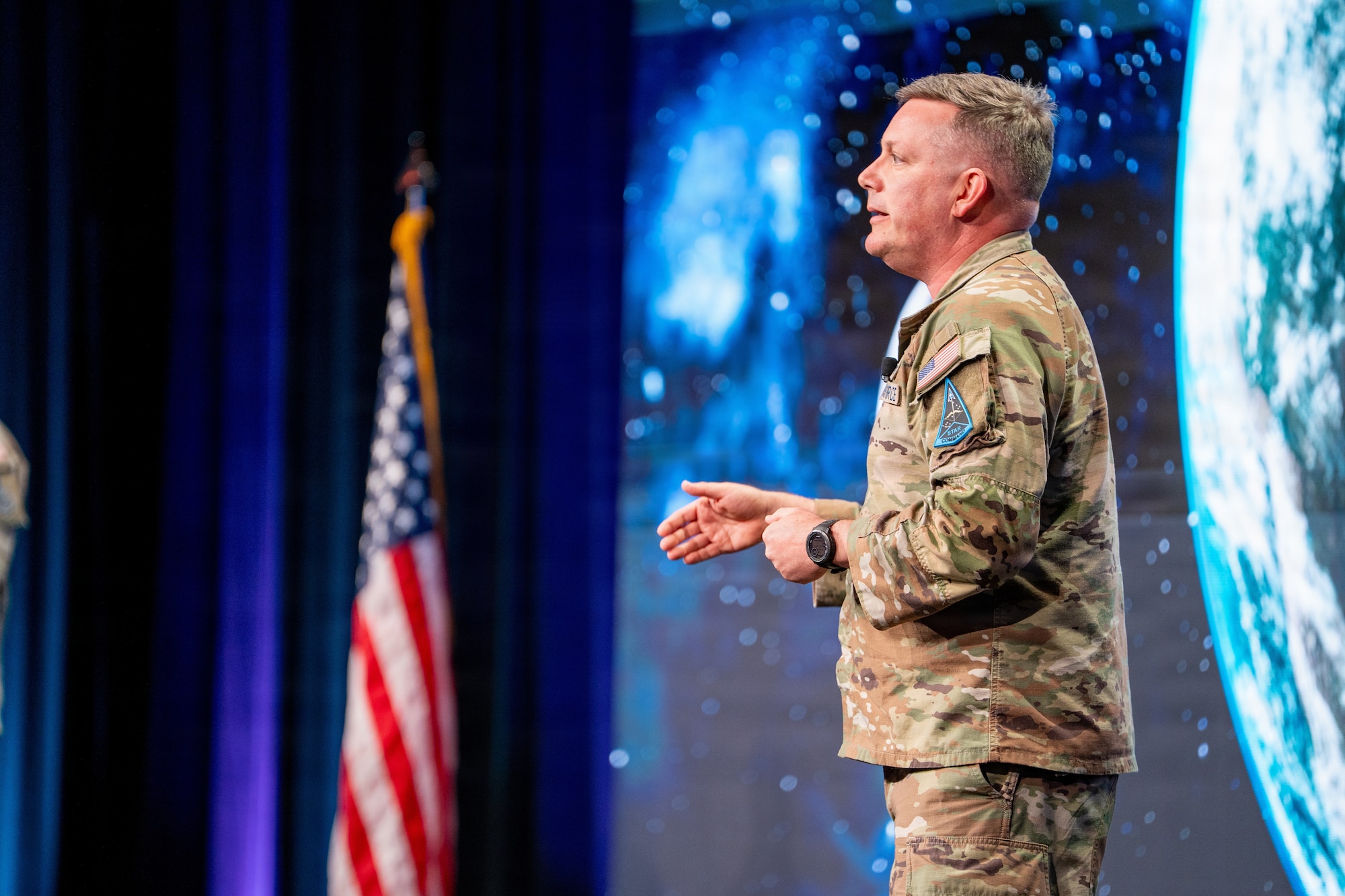 Space Force leader speaking at a conference. They are on stage.