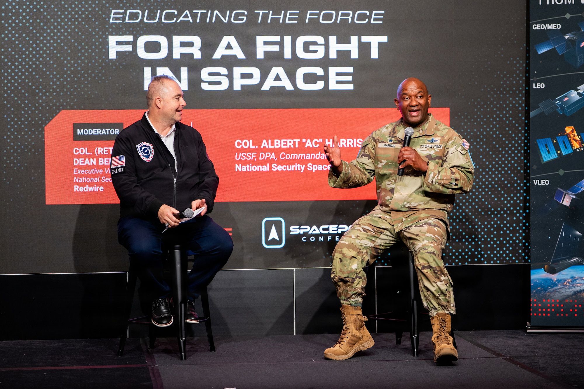 Space Force leader speaking at a conference. They are on stage.