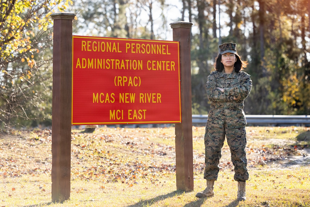 U.S. Marine Lance Cpl. Lance Cpl. Karla Sotoarguello, administrative specialist, Regional Personnel Administration Center (RPAC), Marine Corps Air Station (MCAS) New River, poses for a photo next to the RPAC sign, at MCAS New River in Jacksonville, North Carolina, Dec. 15, 2025. Sotoarguello, the recipient of the December MCAS New River Go-Getter award, enlisted from Chattanooga, Tennessee. (U.S. Marine Corps photo by Sgt. Yvonna Stark)