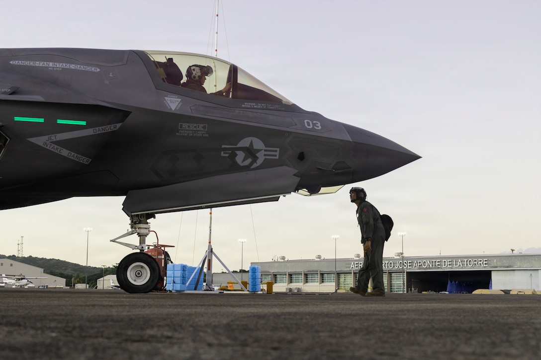 A U.S. Marine Corps plane captain with Marine Fighter Attack Squadron (VMFA) 225, U.S. Marine Corps Forces, South, conducts pre-flight inspections on a U.S. Marine Corps F-35B Lightning II assigned to VMFA-225 at Jose Aponte de la Torre Airport in Ceiba, Puerto Rico, Dec. 9, 2025. U.S. military forces are deployed to the Caribbean in support of the U.S. Southern Command mission, Department of War-directed operations, and the president’s priorities to disrupt illicit drug trafficking and protect the homeland. (U.S. Marine Corps photo)