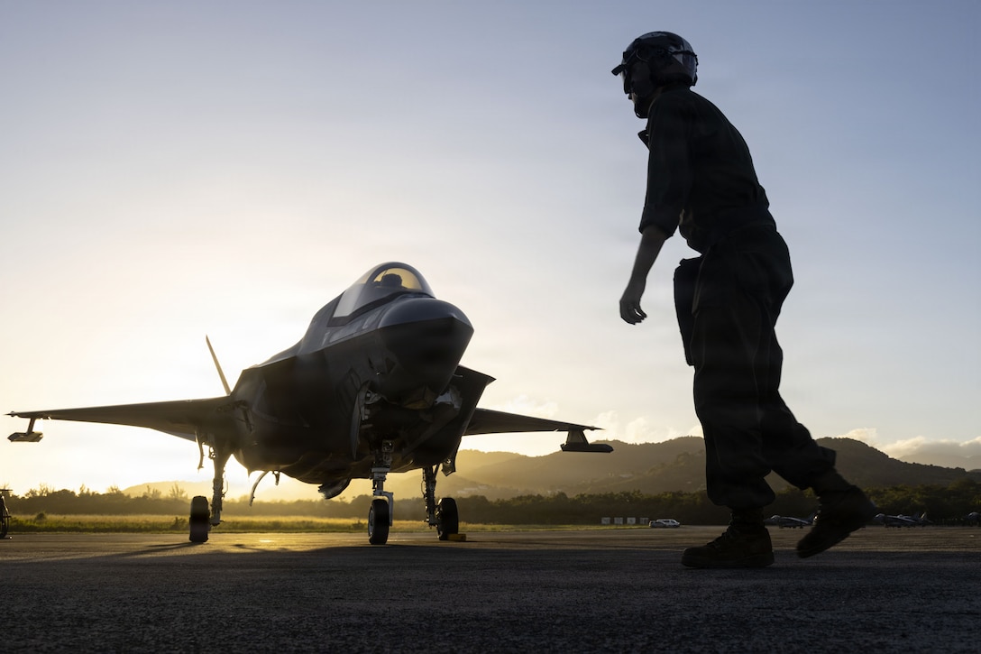 A U.S. Marine Corps plane captain with Marine Fighter Attack Squadron (VMFA) 225, U.S. Marine Corps Forces, South, prepares to launch a U.S. Marine Corps F-35B Lightning II assigned to VMFA-225 at Jose Aponte de la Torre Airport in Ceiba, Puerto Rico, Dec. 9, 2025. U.S. military forces are deployed to the Caribbean in support of the U.S. Southern Command mission, Department of War-directed operations, and the president’s priorities to disrupt illicit drug trafficking and protect the homeland. (U.S. Marine Corps photo)