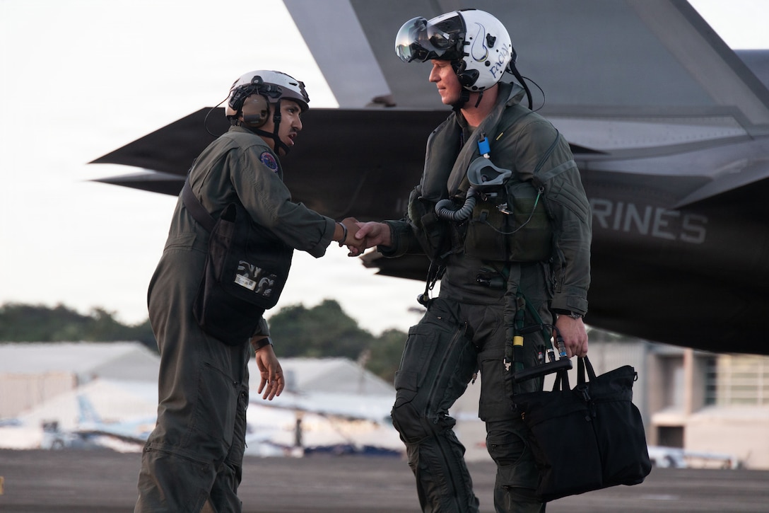 A U.S. Marine Corps plane captain and pilot with Marine Fighter Attack Squadron (VMFA) 225, U.S. Marine Corps Forces, South, greet each other at Jose Aponte de la Torre Airport in Ceiba, Puerto Rico, Dec. 9, 2025. U.S. military forces are deployed to the Caribbean in support of the U.S. Southern Command mission, Department of War-directed operations, and the president’s priorities to disrupt illicit drug trafficking and protect the homeland. (U.S. Marine Corps photo)