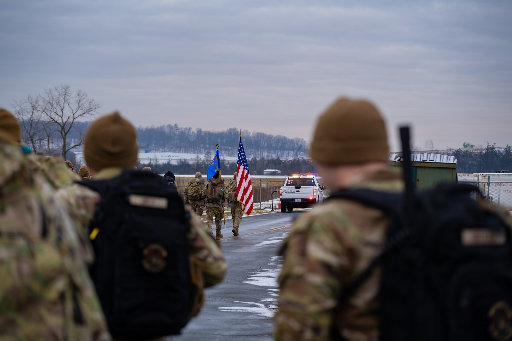Three defenders carry flags in a ruck