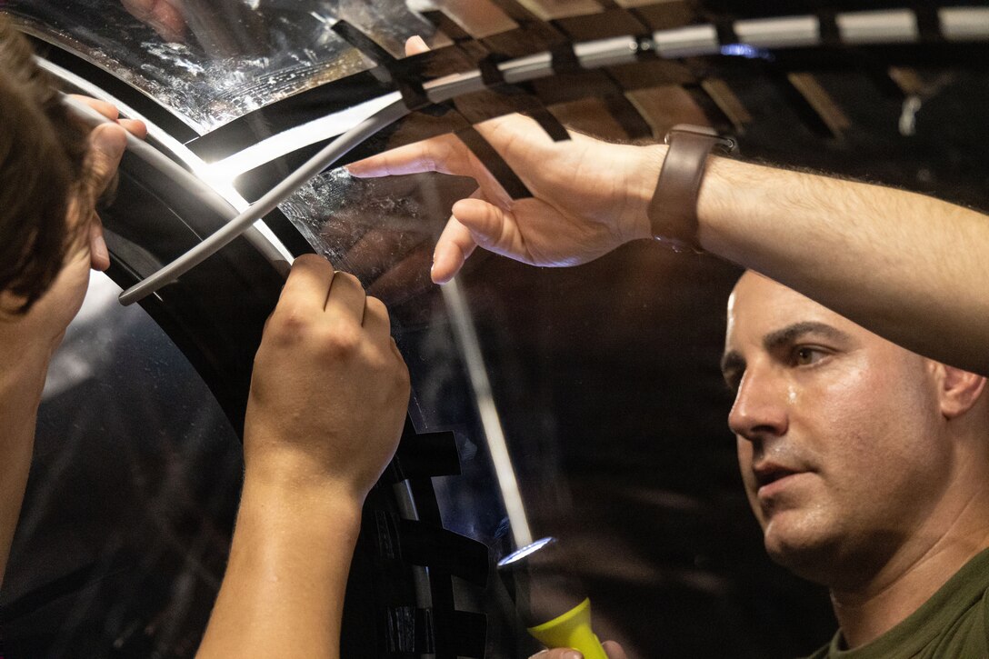 U.S. Marine Corps flight equipment technicians with Marine Fighter Attack Squadron (VMFA) 225, U.S. Marine Corps Forces, South, install a Flexible Linear Shaped Charge on a U.S. Marine Corps F-35B Lightning II canopy assigned to VMFA-225 at Jose Aponte de la Torre Airport in Ceiba, Puerto Rico, Dec. 9, 2025.  U.S. military forces are deployed to the Caribbean in support of the U.S. Southern Command mission, Department of War-directed operations, and the president’s priorities to disrupt illicit drug trafficking and protect the homeland. (U.S. Marine Corps photo)
