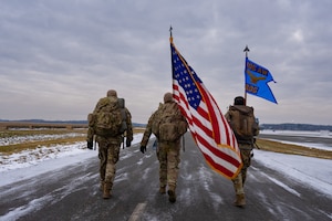 Three defenders carry flags in a ruck