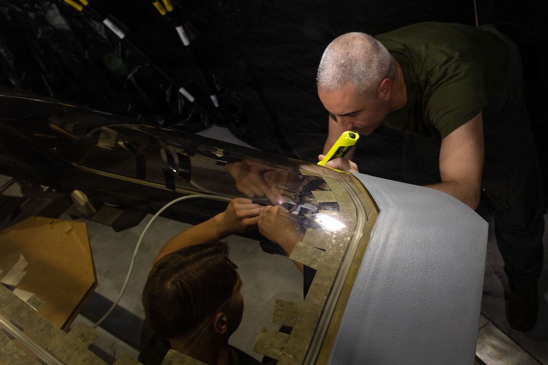 U.S. Marine Corps flight equipment technicians with Marine Fighter Attack Squadron (VMFA) 225, U.S. Marine Corps Forces, South, install a Flexible Linear Shaped Charge on a U.S. Marine Corps F-35B Lightning II canopy assigned to VMFA-225 at Jose Aponte de la Torre Airport in Ceiba, Puerto Rico, Dec. 9, 2025.  U.S. military forces are deployed to the Caribbean in support of the U.S. Southern Command mission, Department of War-directed operations, and the president’s priorities to disrupt illicit drug trafficking and protect the homeland. (U.S. Marine Corps photo)