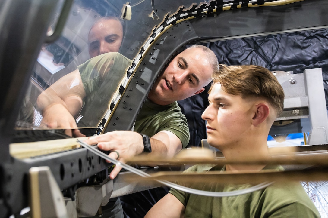 U.S. Marine Corps flight equipment technicians with Marine Fighter Attack Squadron (VMFA) 225, U.S. Marine Corps Forces, South, install a Flexible Linear Shaped Charge on a U.S. Marine Corps F-35B Lightning II canopy assigned to VMFA-225 at Jose Aponte de la Torre Airport in Ceiba, Puerto Rico, Dec. 9, 2025.  U.S. military forces are deployed to the Caribbean in support of the U.S. Southern Command mission, Department of War-directed operations, and the president’s priorities to disrupt illicit drug trafficking and protect the homeland. (U.S. Marine Corps photo)