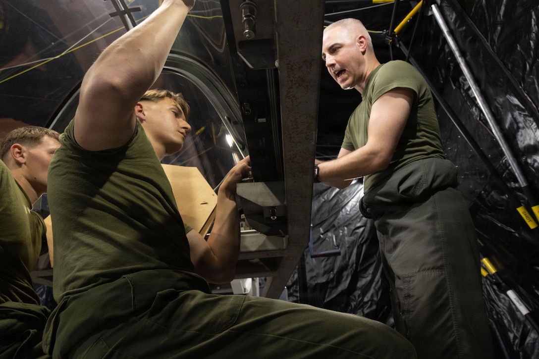 U.S. Marine Corps flight equipment technicians with Marine Fighter Attack Squadron (VMFA) 225, U.S. Marine Corps Forces, South, install a Flexible Linear Shaped Charge on a U.S. Marine Corps F-35B Lightning II canopy assigned to VMFA-225 at Jose Aponte de la Torre Airport in Ceiba, Puerto Rico, Dec. 9, 2025.  U.S. military forces are deployed to the Caribbean in support of the U.S. Southern Command mission, Department of War-directed operations, and the president’s priorities to disrupt illicit drug trafficking and protect the homeland. (U.S. Marine Corps photo)