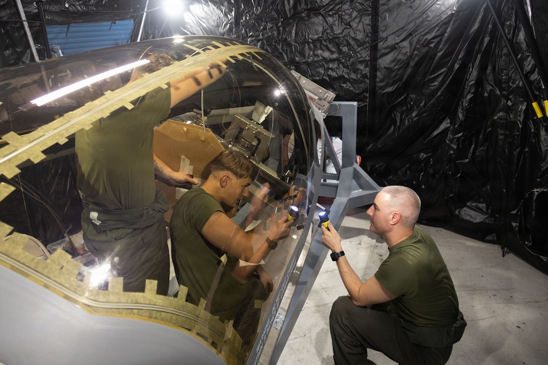 U.S. Marine Corps flight equipment technicians with Marine Fighter Attack Squadron (VMFA) 225, U.S. Marine Corps Forces, South, install a Flexible Linear Shaped Charge on a U.S. Marine Corps F-35B Lightning II canopy assigned to VMFA-225 at Jose Aponte de la Torre Airport in Ceiba, Puerto Rico, Dec. 9, 2025.  U.S. military forces are deployed to the Caribbean in support of the U.S. Southern Command mission, Department of War-directed operations, and the president’s priorities to disrupt illicit drug trafficking and protect the homeland. (U.S. Marine Corps photo)
