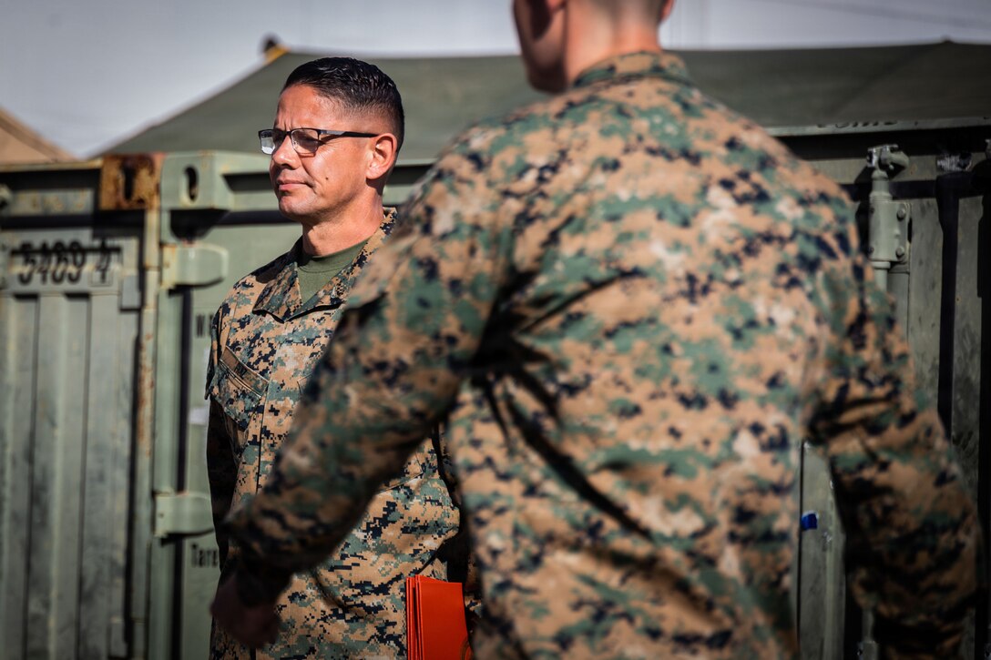 U.S. Marine Corps Sgt. Maj. Carlos A. Ruiz, the 20th Sergeant Major of the Marine Corps, stands at attention while U.S. Marines with Marine Fighter Attack Squadron (VMFA) 225, U.S. Marine Corps Forces, South, report during a promotion ceremony at Jose Aponte de la Torre Airport in Ceiba, Puerto Rico, Dec. 12, 2025. U.S. military forces are deployed to the Caribbean in support of the U.S. Southern Command mission, Department of War-directed operations, and the president’s priorities to disrupt illicit drug trafficking and protect the homeland. (U.S. Marine Corps photo)