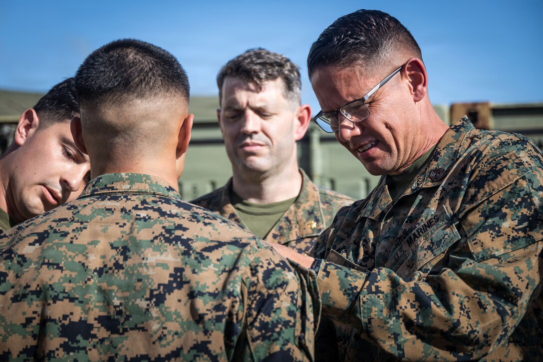 U.S. Marine Corps Sgt. Maj. Carlos A. Ruiz, the 20th Sergeant Major of the Marine Corps, pins a U.S. Marine with Marine Fighter Attack Squadron (VMFA) 225, U.S. Marine Corps Forces, South, to corporal at Jose Aponte de la Torre Airport in Ceiba, Puerto Rico, Dec. 12, 2025. U.S. military forces are deployed to the Caribbean in support of the U.S. Southern Command mission, Department of War-directed operations, and the president’s priorities to disrupt illicit drug trafficking and protect the homeland. (U.S. Marine Corps photo)