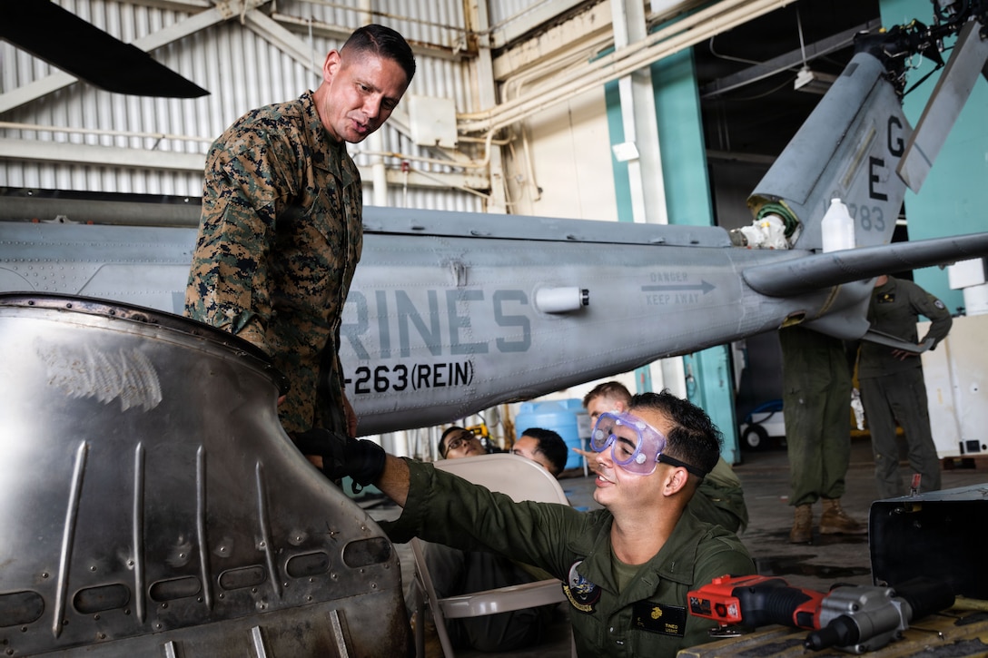 U.S. Marine Corps Sgt. Maj. Carlos A. Ruiz, the 20th Sergeant Major of the Marine Corps, greets a U.S. Marine Corps maintainer with Marine Medium Tiltrotor Squadron (VMM) 263, 22nd Marine Expeditionary Unit (Special Operations Capable), at Jose Aponte de la Torre Airport in Ceiba, Puerto Rico, Dec. 12, 2025. U.S. military forces are deployed to the Caribbean in support of the U.S. Southern Command mission, Department of War-directed operations, and the president’s priorities to disrupt illicit drug trafficking and protect the homeland. (U.S. Marine Corps photo)