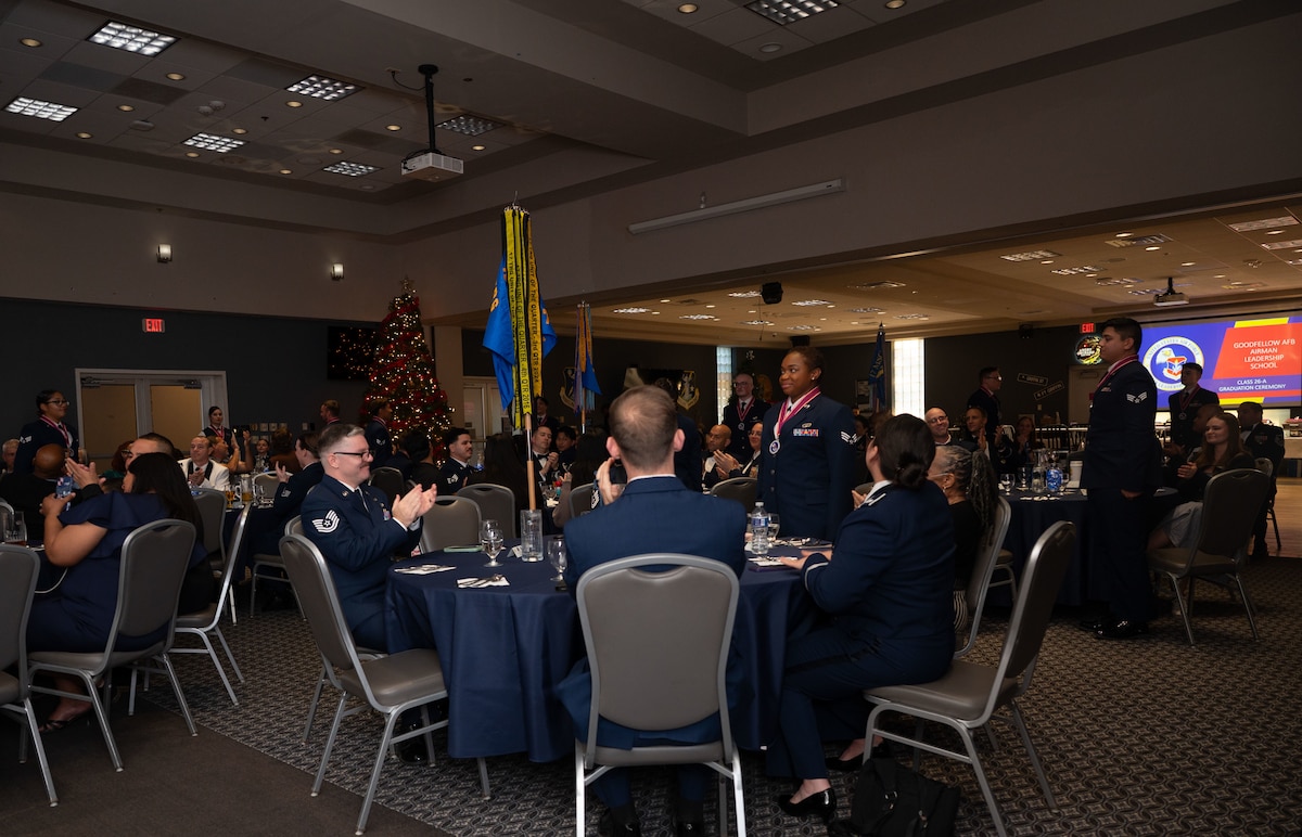 Airmen Leadership School graduates are asked to stand up during their graduation ceremony to be recognized.