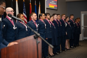 The newest graduates are recognized by standing in front of all guests during their graduation ceremony.