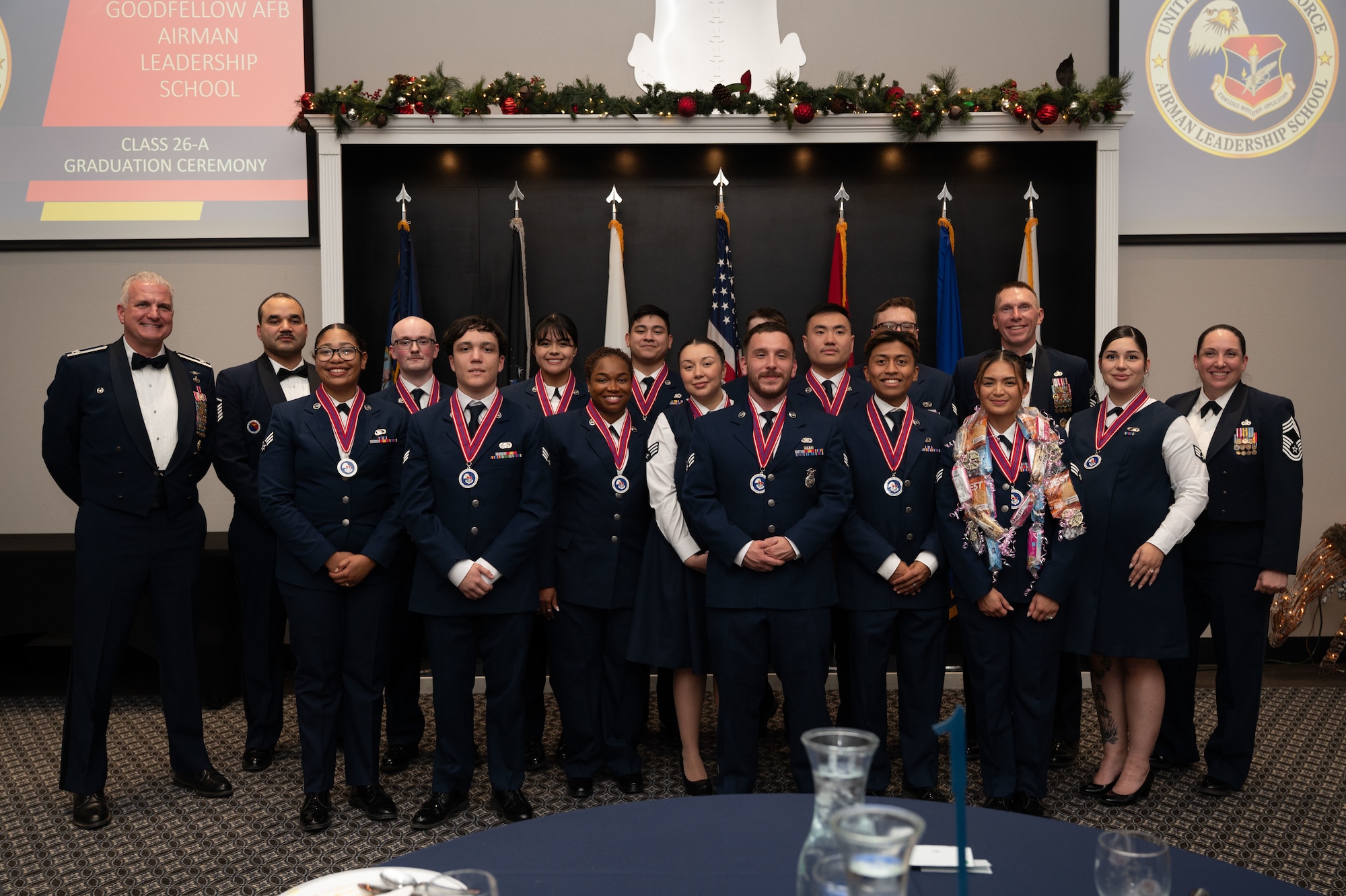 A group photo of the graduating class with the base commander and instructors.