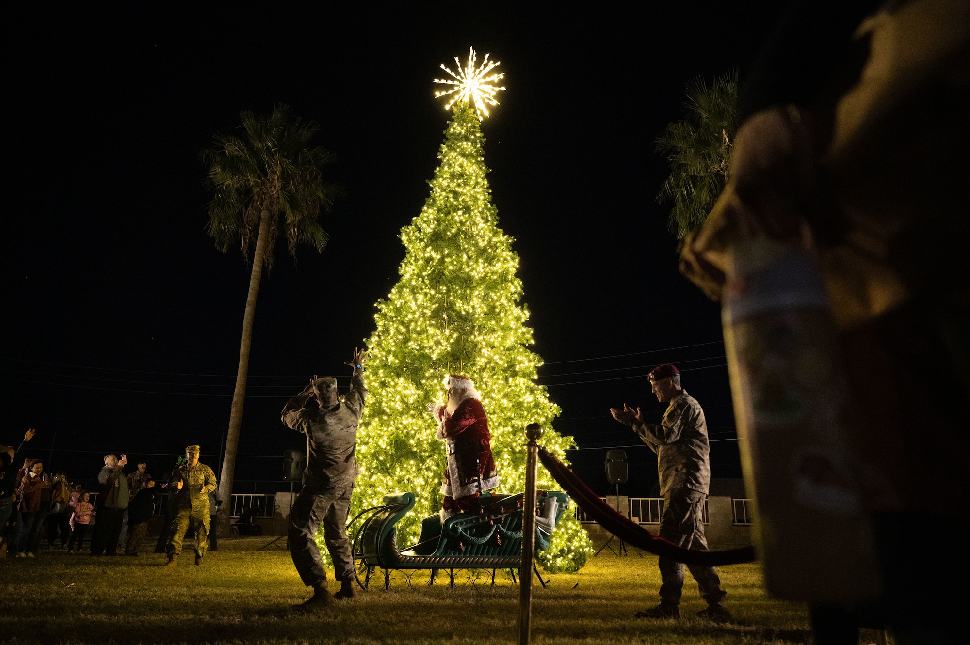 U.S. Air Force Chief Master Sgt. Kelvin Hatcher, 355th Wing command chief, kicks off the 2025 Christmas Tree Lighting at Davis-Monthan Air Force Base, Arizona, Dec. 5, 2025. The ceremony marked the start of the base’s holiday celebrations. (U.S. Air Force photo by Airman 1st Class Jaden Kidd)