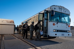 People board a bus