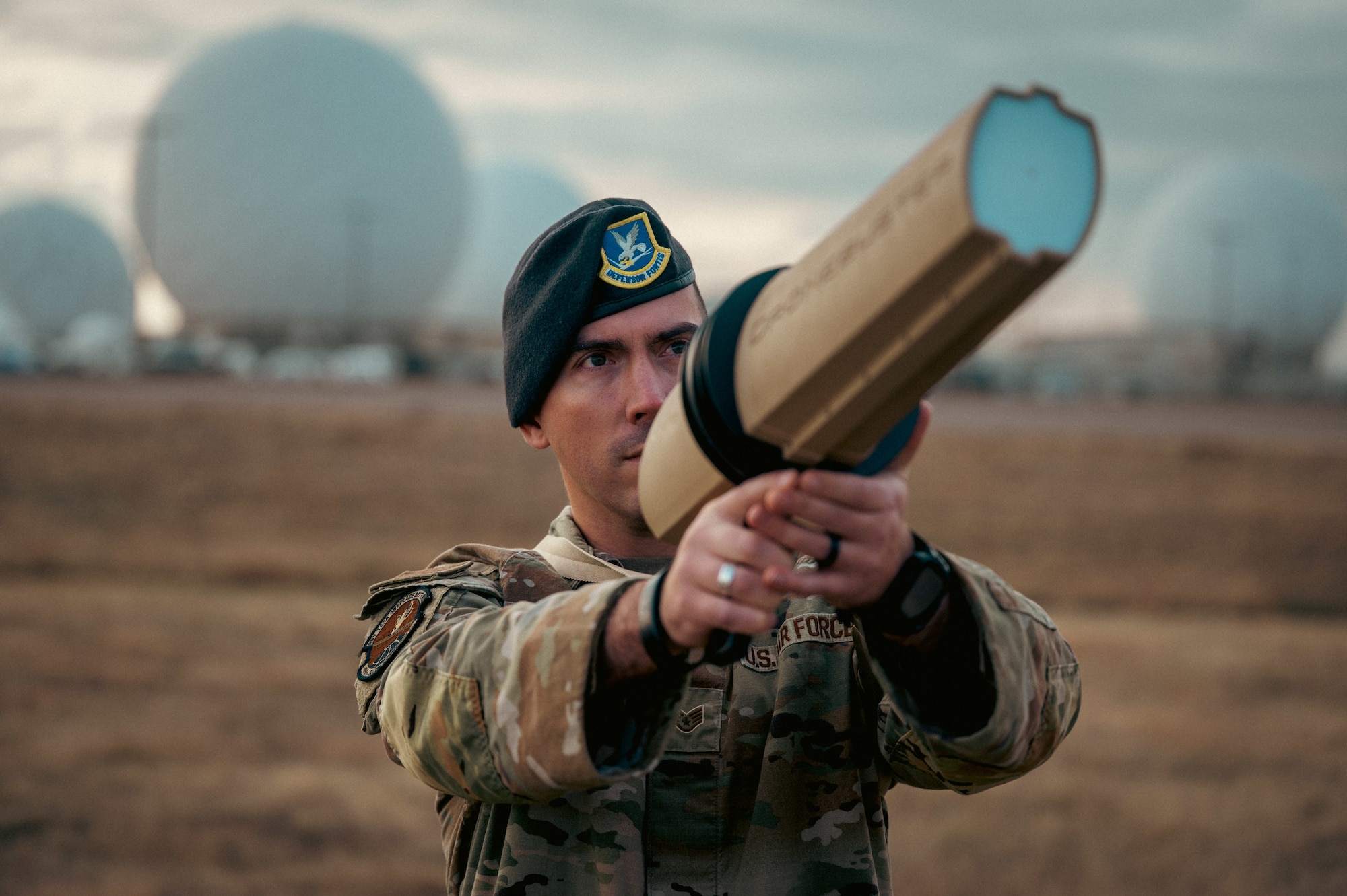 man stands with a weapon