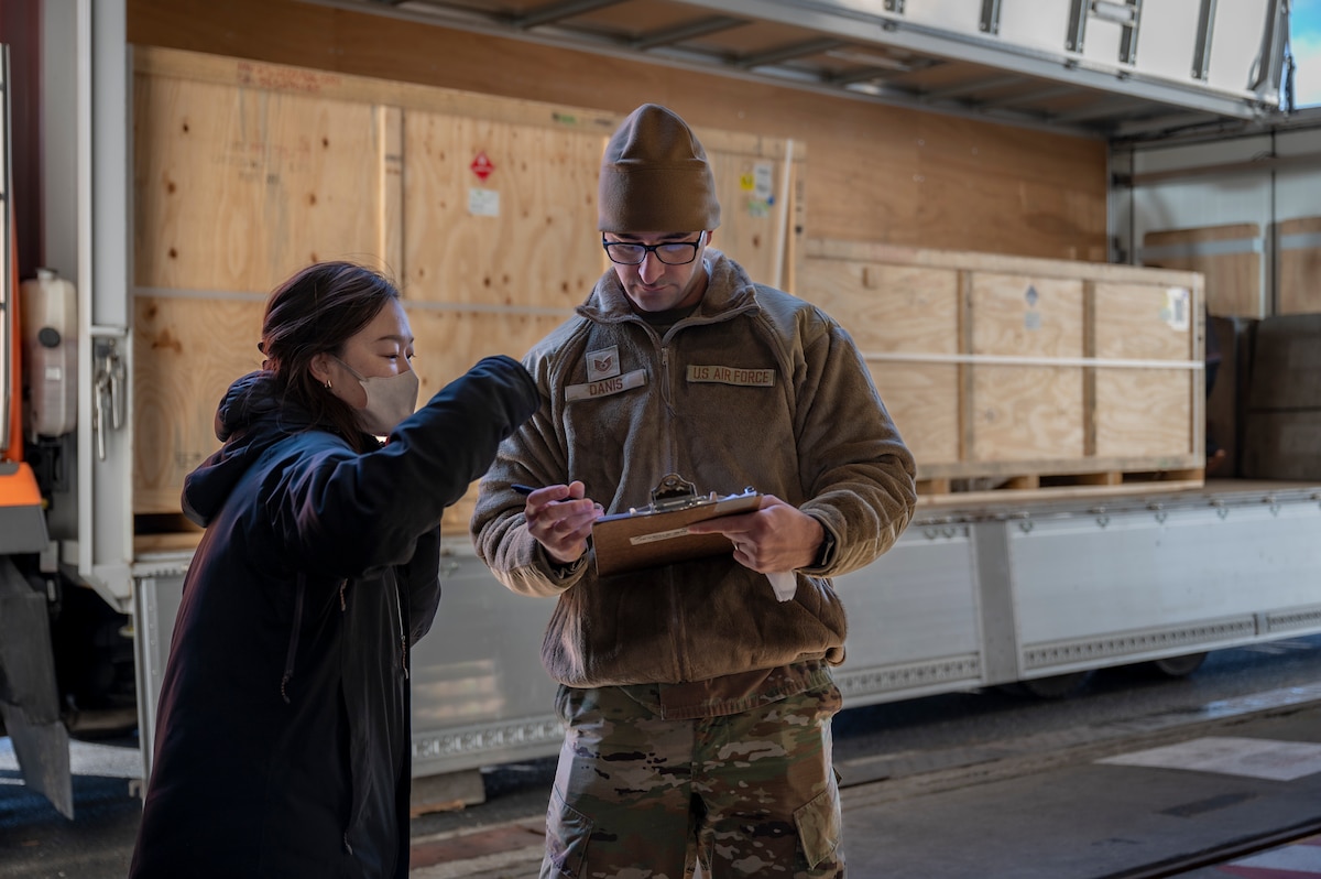 U.S. Air Force Tech. Sgt. Eric Danis, 13th Fighter Generation Squadron support section chief, checks cargo paperwork at Misawa Air Base, Japan, Dec. 15, 2025. Misawa AB received F-35 Lightning II equipment in preparation for their arrival, supporting the 35th Fighter Wing’s mission of projecting airpower and strengthening deterrence in the Indo-Pacific region. (U.S. Air Force photo by Senior Airman Brittany Russell)