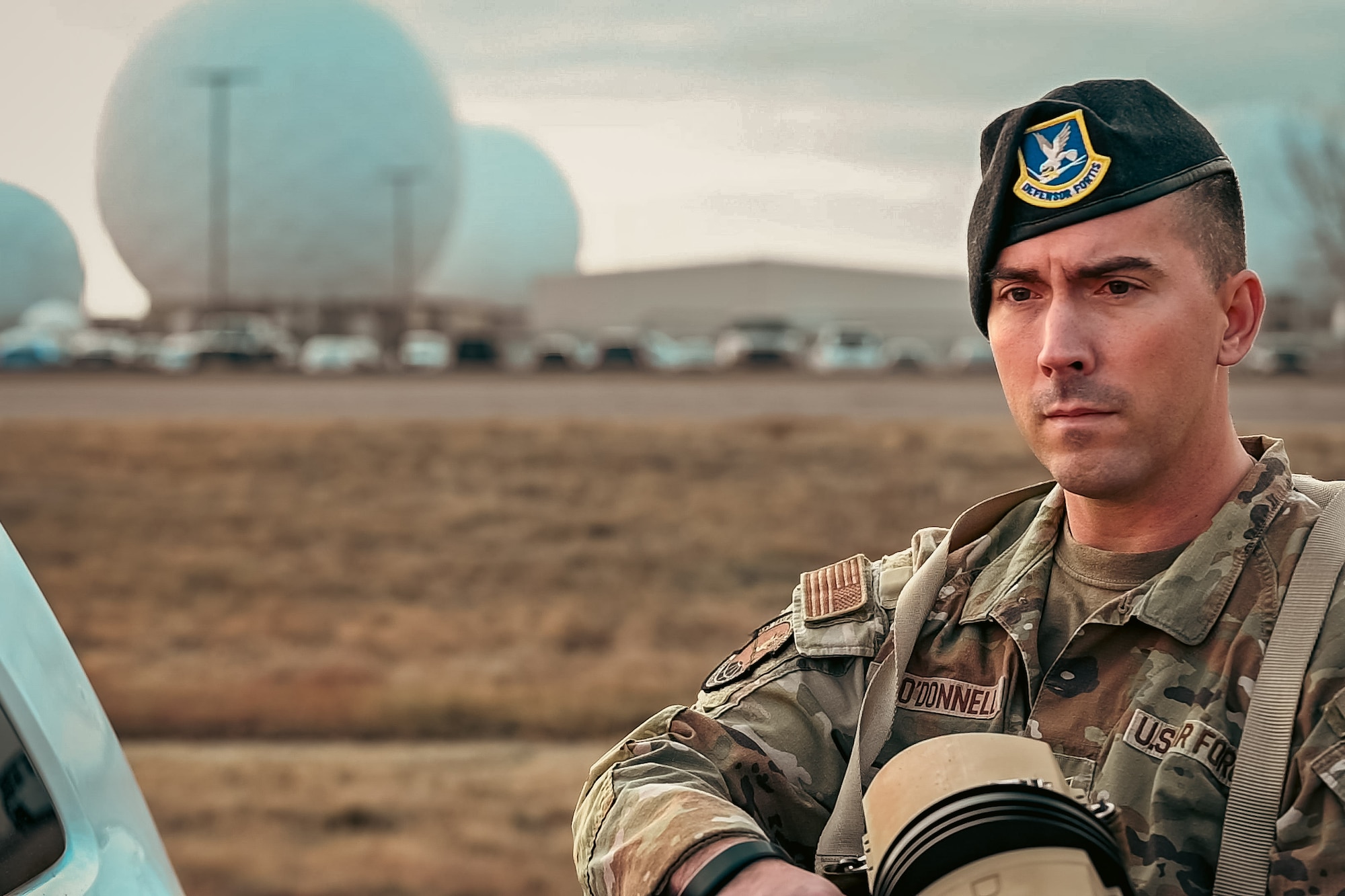 man stands with a weapon