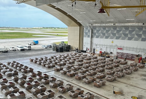 Humanitarian assistance bundles are assembled during Operation Christmas Drop 25.
