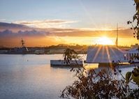 The Arleigh Burke-class guided-missile destroyer USS Carl M. Levin (DDG 120) conducts a pass-in-review during the 84th National Pearl Harbor Remembrance Day ceremony at the Pearl Harbor National Memorial Dec. 7, 2025.