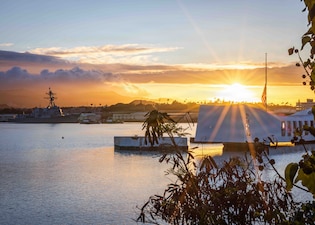 The Arleigh Burke-class guided-missile destroyer USS Carl M. Levin (DDG 120) conducts a pass-in-review during the 84th National Pearl Harbor Remembrance Day ceremony at the Pearl Harbor National Memorial Dec. 7, 2025.