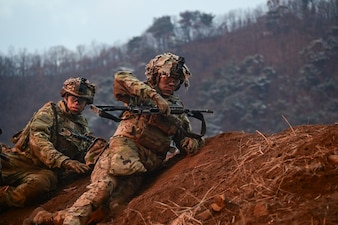 U.S. Army Soldiers with 1st Battalion, 38th Infantry Regiment advance to a covered position during a company live-fire iteration at Rodriguez Live Fire Complex, Republic of Korea, Dec. 13, 2024.