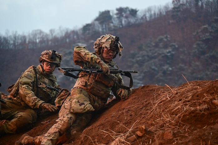 U.S. Army Soldiers with 1st Battalion, 38th Infantry Regiment advance to a covered position during a company live-fire iteration at Rodriguez Live Fire Complex, Republic of Korea, Dec. 13, 2024.