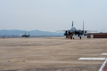 Republic of Korea Air Force F-15s taxi to parking after landing.