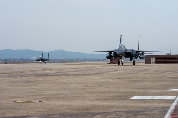 Republic of Korea Air Force F-15s taxi to parking after landing.