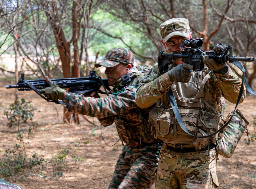 ANDHRA PRADESH, India (April 3, 2025) — A Soldier assigned to Bayonet Company, 1st Battalion, 5th Infantry Regiment, 1st Infantry Brigade Combat Team, 11th Airborne Division, provides cover for an Indian Army Soldier, under the command of Col. Yash Agrawal, assigned to the 4/8 Gurkha Rifles Infantry Battalion, 91st Infantry Brigade, during Exercise Tiger Triumph near Visakhapatnam, India, April 3, 2025.