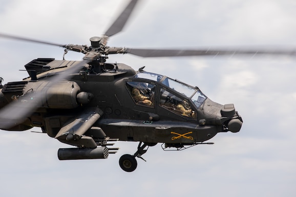 U.S. Army pilots assigned to the 16th Combat Aviation Brigade, 4-6 Air Cavalry Squadron, Joint Base Lewis-McChord, Washington, fly a AH-64E Apache Guardian helicopter at a joint strike live fire exercise during Super Garuda Shield 25 in Baturaja, Indonesia, Sept. 1, 2025.