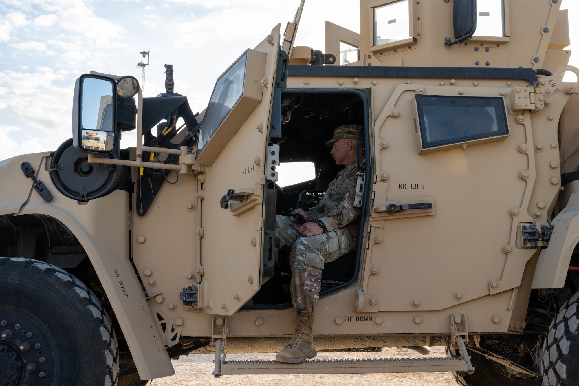 U.S. Air Force Col. Randy Combs, 332nd Expeditionary Air Base Group commander, prepares to drive a Joint Light Tactical Vehicle in the U.S. Central Command area of responsibility, Dec. 2, 2025.  The JLTV is equipped with structural upgrades, including a new drive shaft and self inflating tires, to better perform in a variety of situations. (U.S. Air Force photo by Senior Airman Kari Degraffenreed)