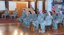 Ten Pennsylvania National Guard Soldiers from the 109th Mobile Public Affairs Detachment, 213th Regional Support Group were honored in a departure ceremony conducted at the Keystone Conference Center Dec. 13. The unit will deploy to Europe in support of U.S. Special Operations Command Europe. (Pennsylvania National Guard photo by Wayne V. Hall)