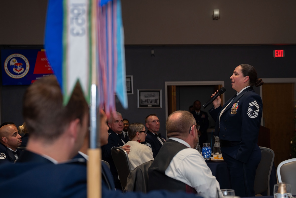 U.S. Air Force CMSgt. Stephanie Zengerle, 315th Training Squadron Senior Enlisted Leader, addresses Airmen Leadership School graduates, family, and service members during the graduation ceremony.