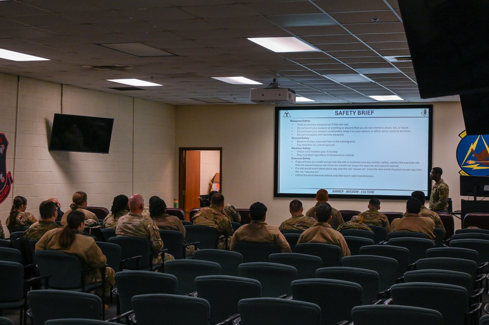people watch a safety brief