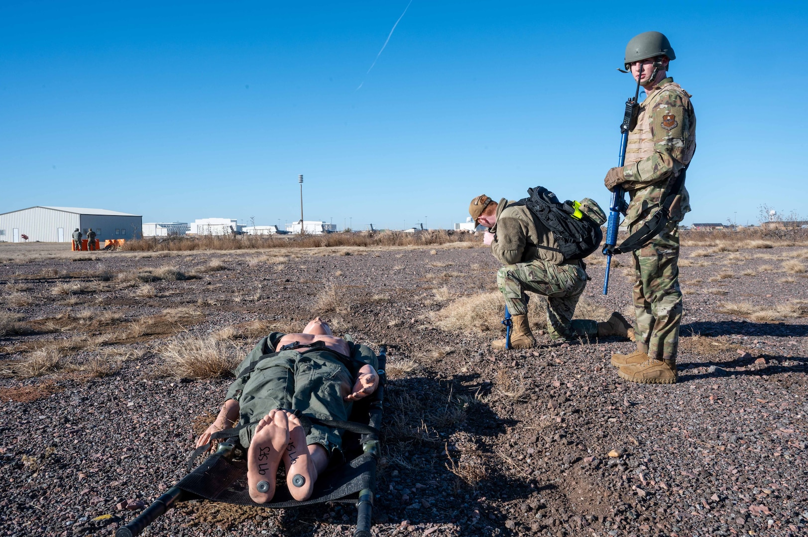 person radios while someone guards them